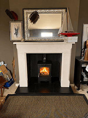 white surround and black hearth with rendered firebox